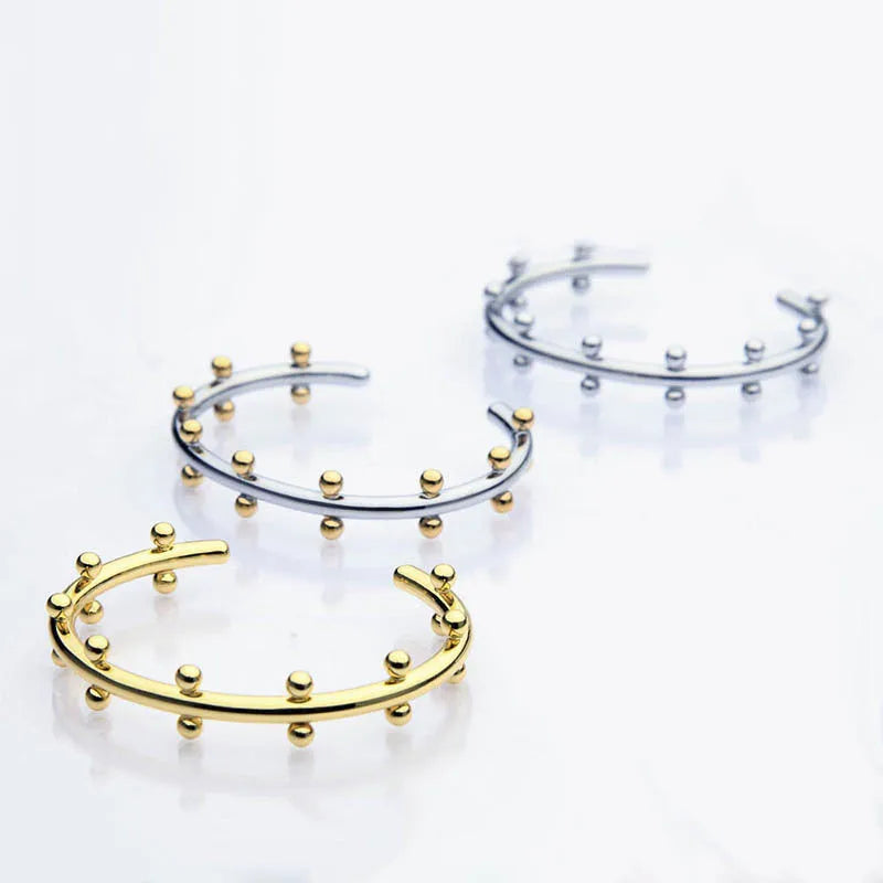 Stainless steel C-shaped bracelet with textured rivet bean beads and adjustable alloy chain