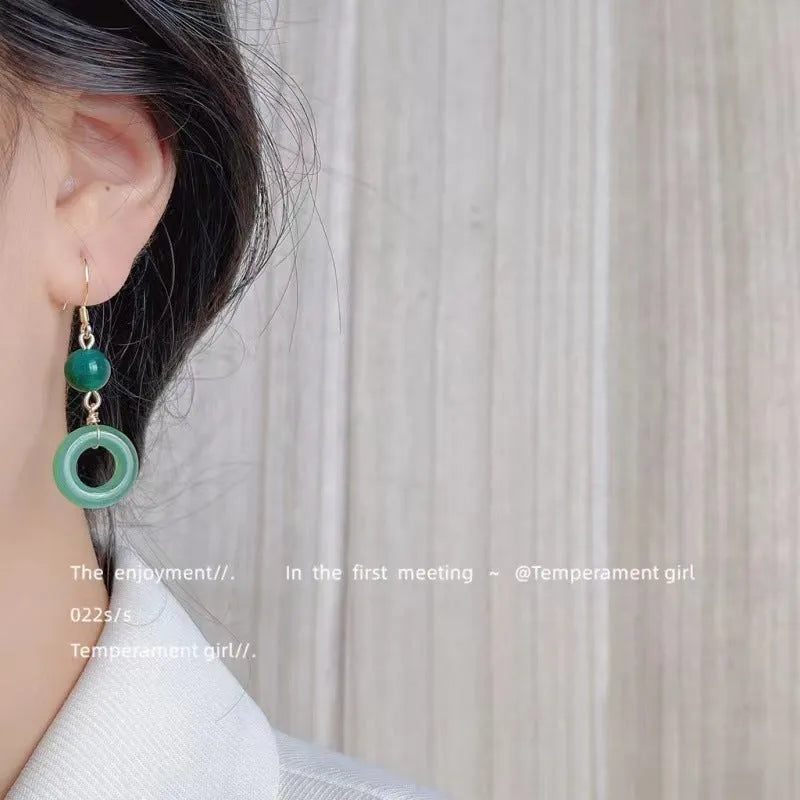 Green zinc alloy earrings with Chinese peace buckle design and geometric pattern