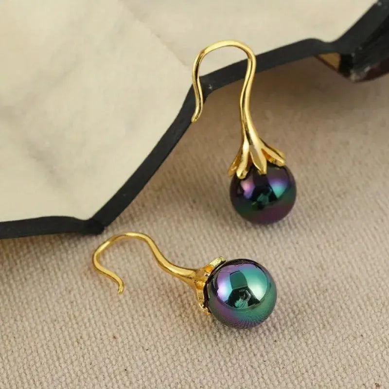 A pair of gold-coloured retro-style fashion earrings for women