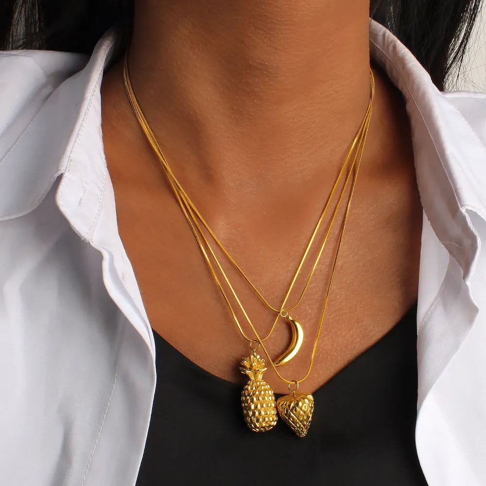 Stainless steel women's necklace with a detailed fruit charm pendant on a regular chain.