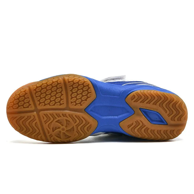 White and blue low-top badminton shoes with ribbed sole and round toe