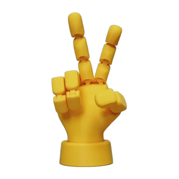 Yellow PLA movable joint hand props ornament with articulated fingers on white background