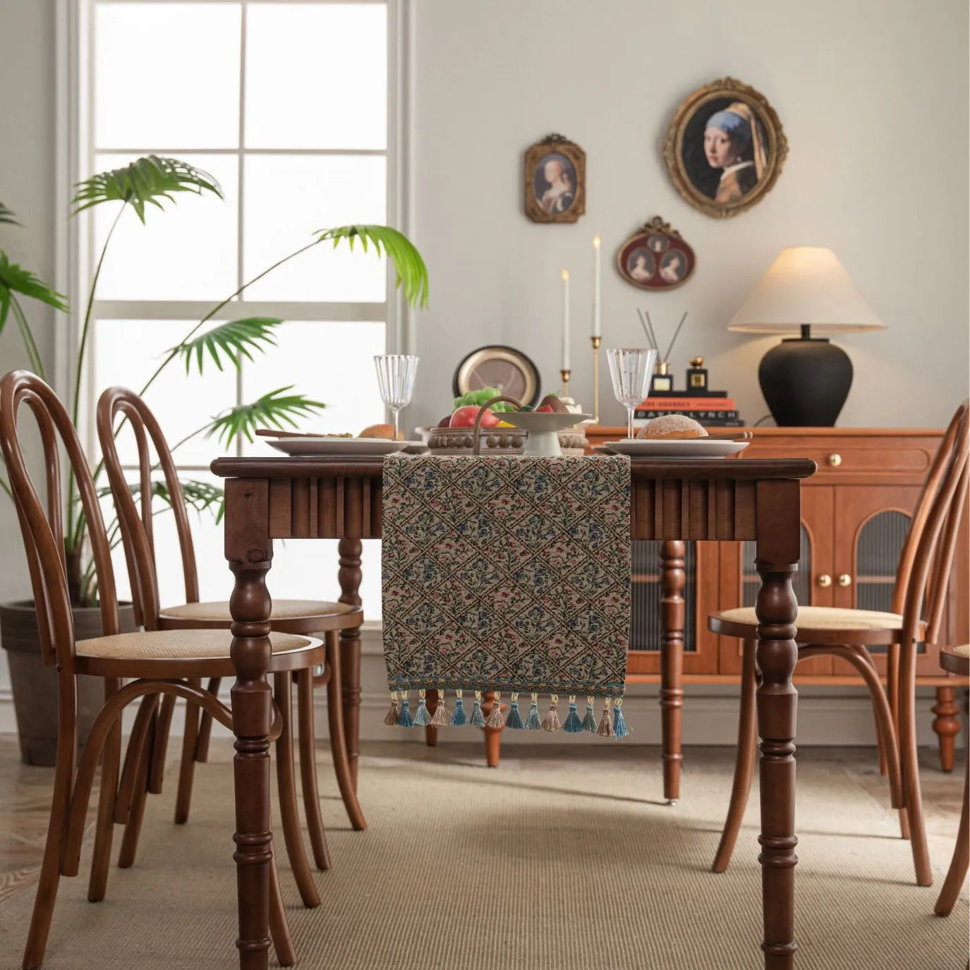 Dark blue striped Nordic style table runner with bouquet tassel decoration laid flat on a table.