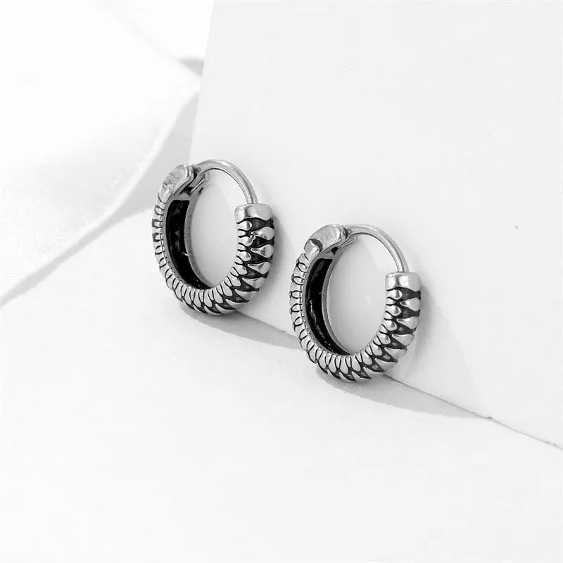 Silver geometric twist earrings with striped pattern on stainless steel