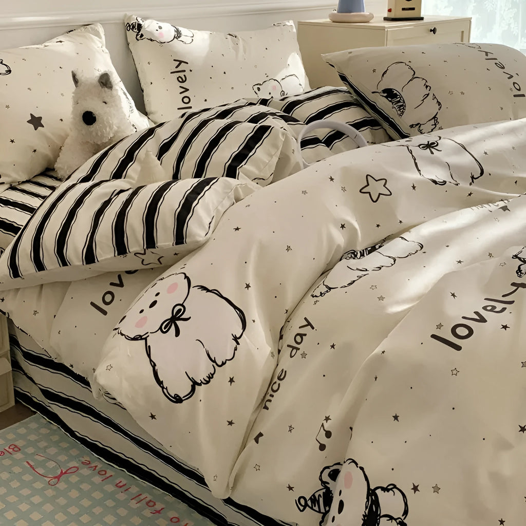 Cartoon dog pattern cotton four-piece bedding set on bed with duvet cover, sheet, and pillowcases