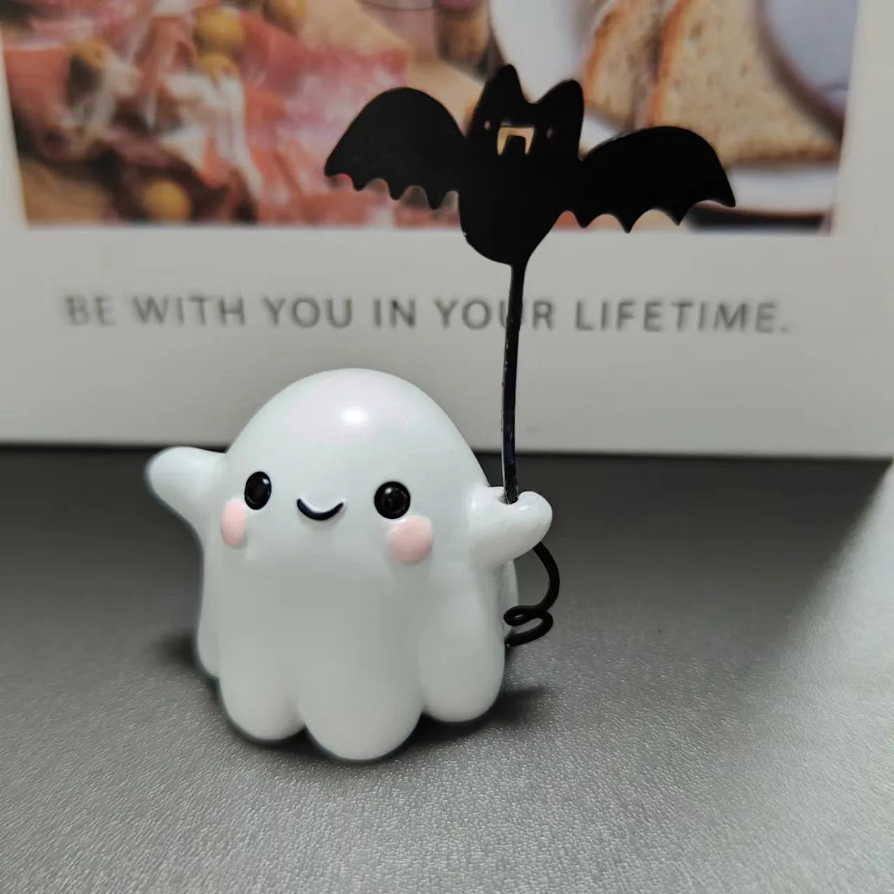Mini resin ghost dog statue holding a bat, a Halloween decoration measuring 4cm.