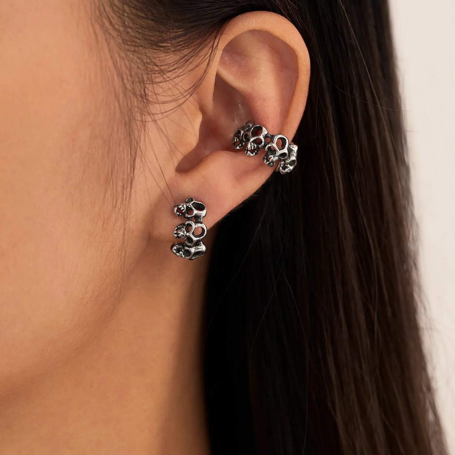 Retro hollow skull stainless steel clip-on earrings with geometric design