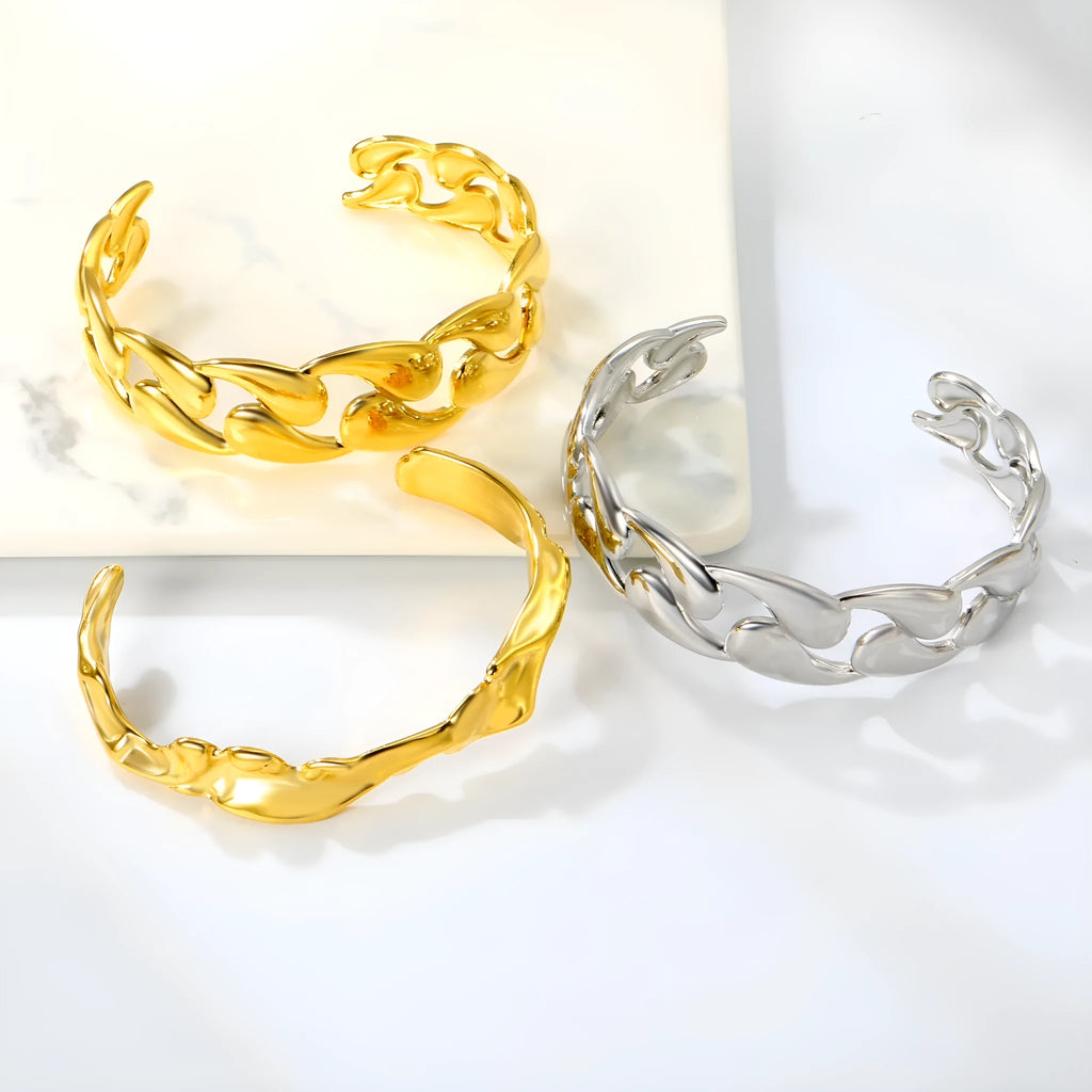 Contemporary stainless steel and alloy bracelet in European-American style on a wrist.