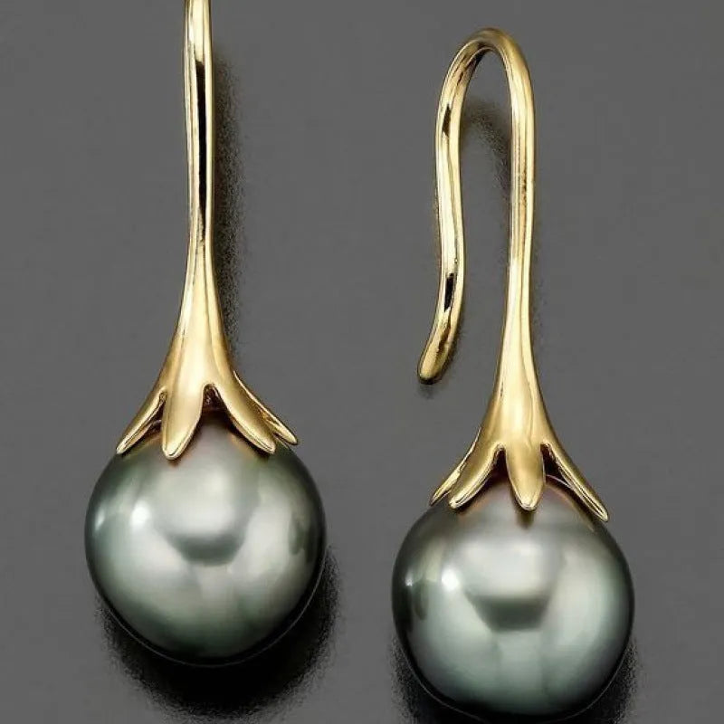 A pair of gold-coloured retro-style fashion earrings for women