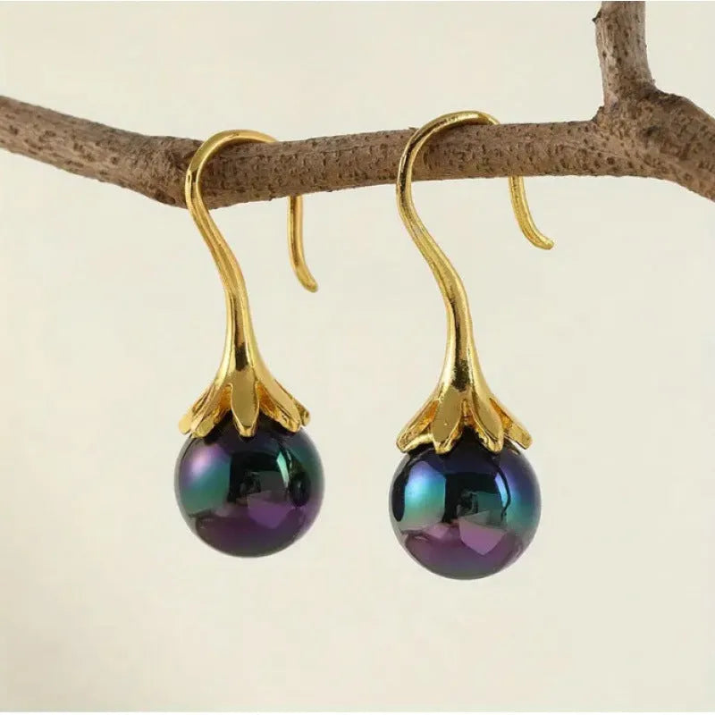 A pair of gold-coloured retro-style fashion earrings for women