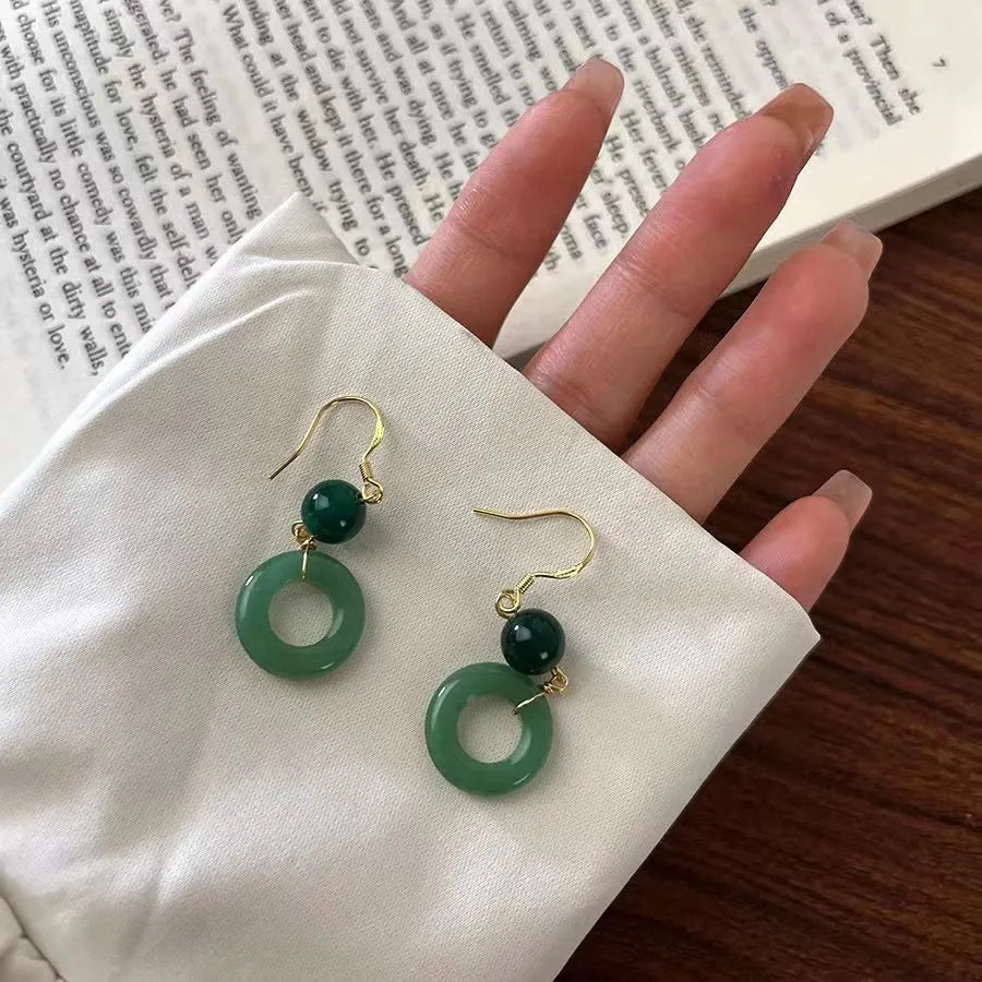 Green zinc alloy earrings with Chinese peace buckle design and geometric pattern