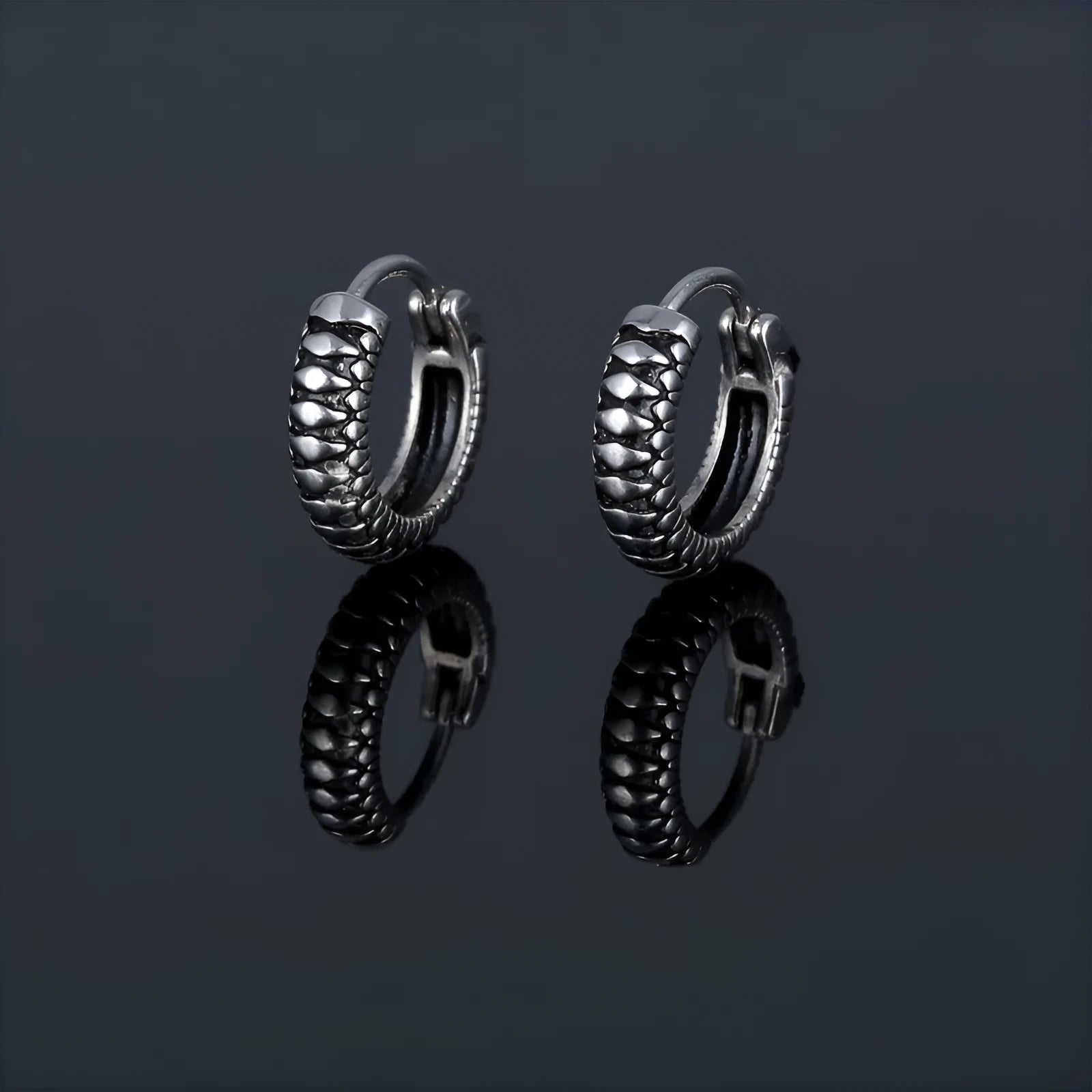 Silver geometric twist earrings with striped pattern on stainless steel