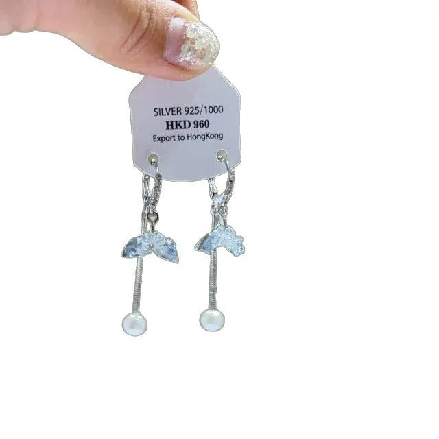 Geometric heart-shaped women's ear clip with rhinestones and a dangling tassel.