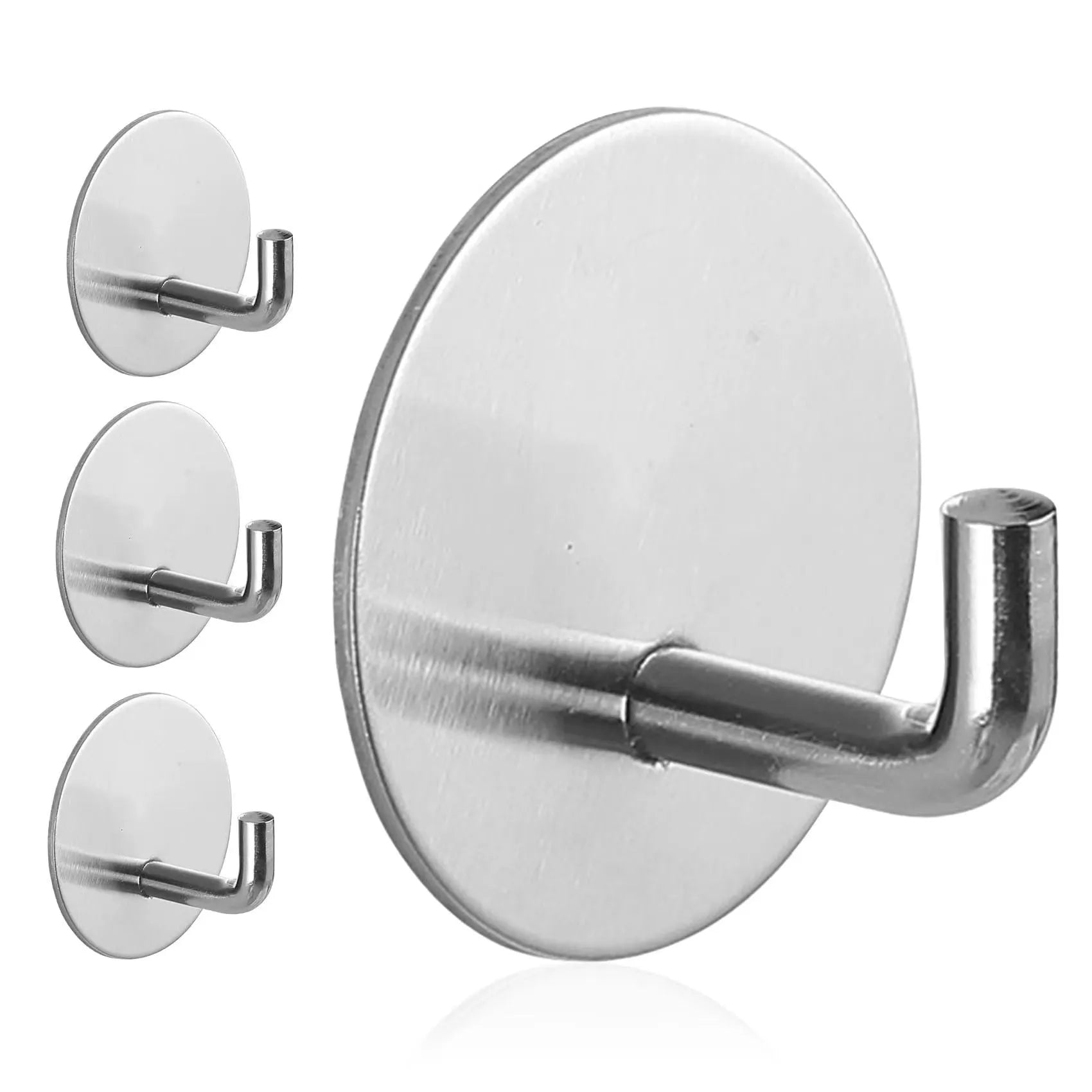 Stainless steel self-adhesive wall hook in black and polished finishes, shown with a towel hanging from it.