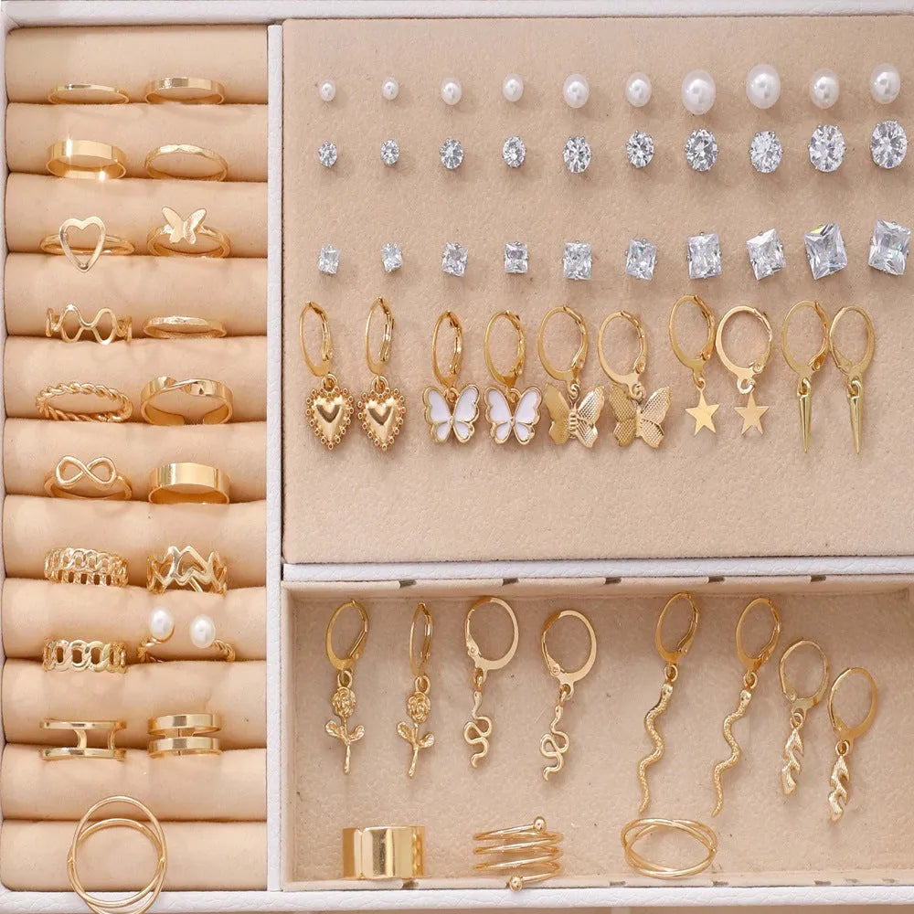 108-piece set of gold and yellow geometric round alloy pearl earrings for women on a plain background.