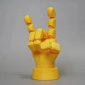 Yellow PLA movable joint hand props ornament with articulated fingers on white background