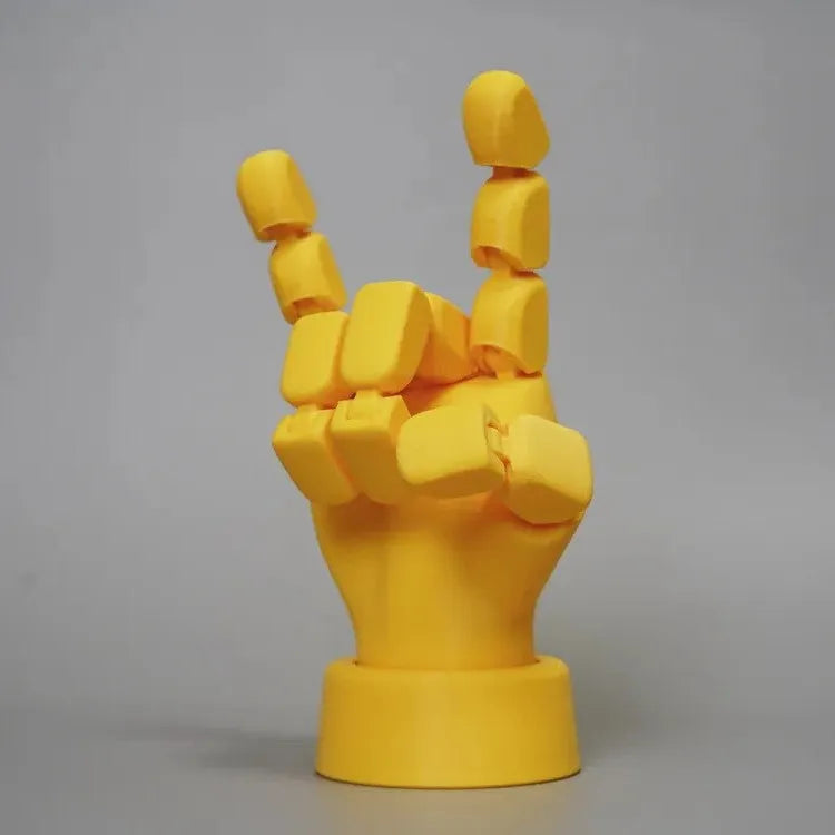 Yellow PLA movable joint hand props ornament with articulated fingers on white background