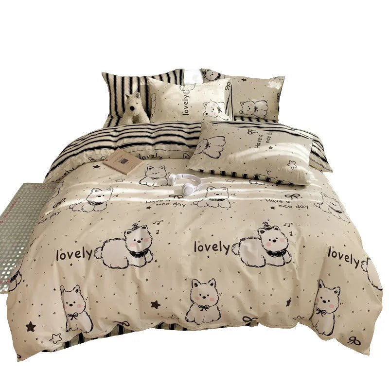 Cartoon dog pattern cotton four-piece bedding set on bed with duvet cover, sheet, and pillowcases