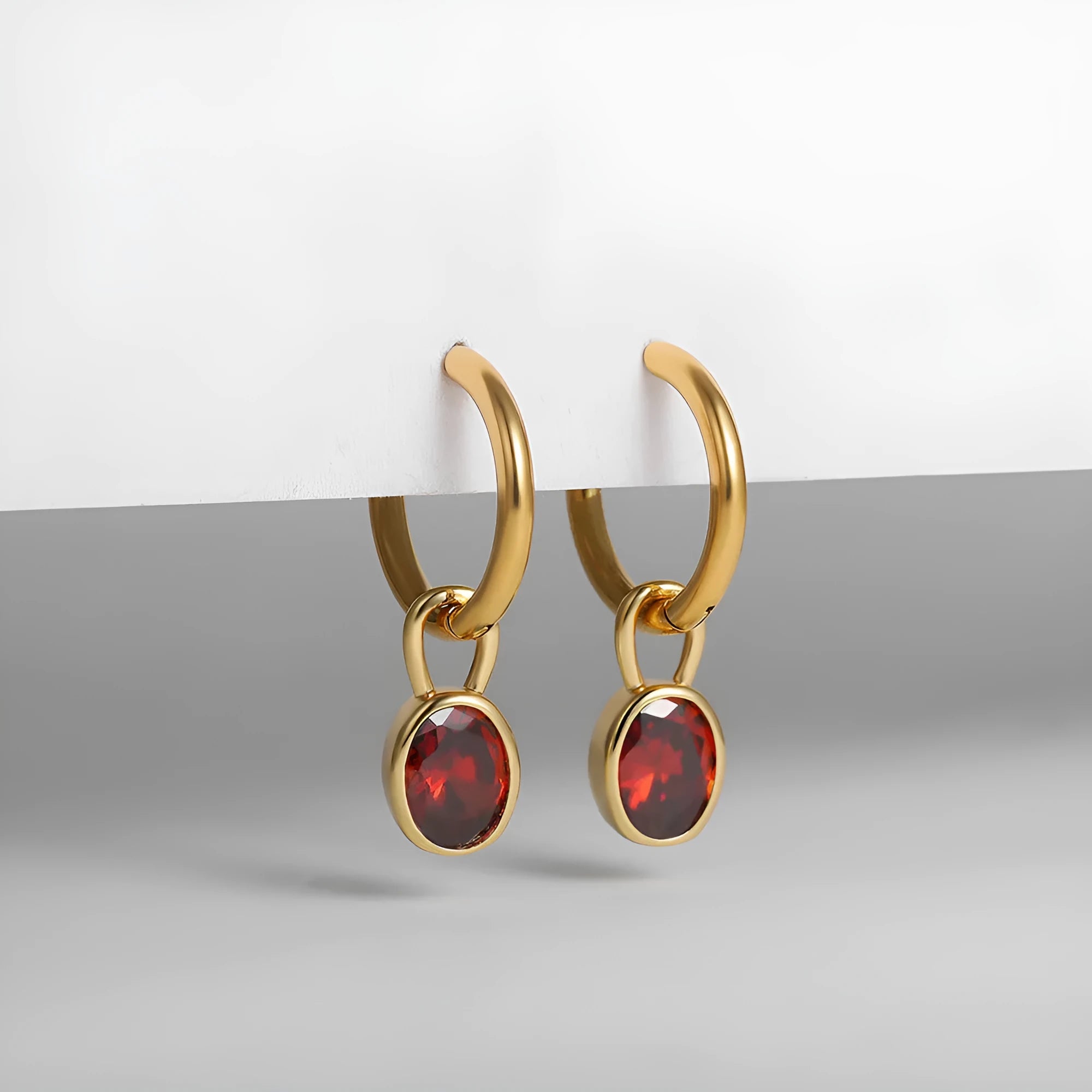 Women's copper oval zircon earrings in retro style, showing colour options including emerald and army green.