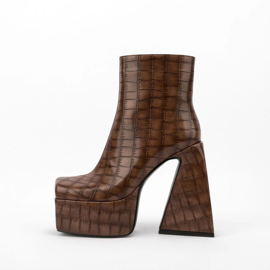 Women's ankle boot with a high heel, shown in a solid colour like beige, brown, red, green, or black.