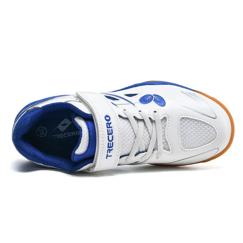 White and blue low-top badminton shoes with ribbed sole and round toe