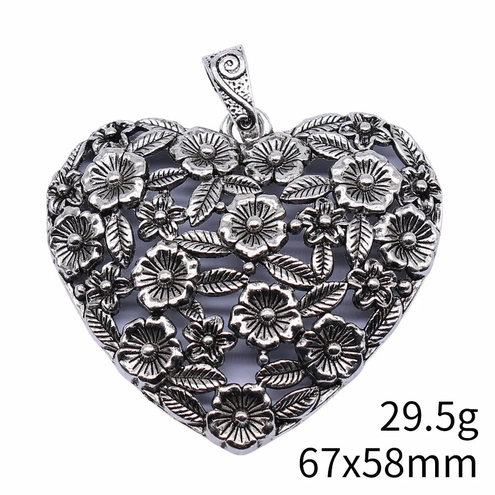 Hollow flower love pendant in ancient silver alloy finish, 67x58mm, on white background