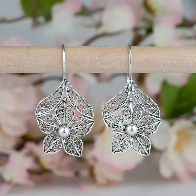 Silver alloy hollow flower leaf-shaped earrings for women retro simple style