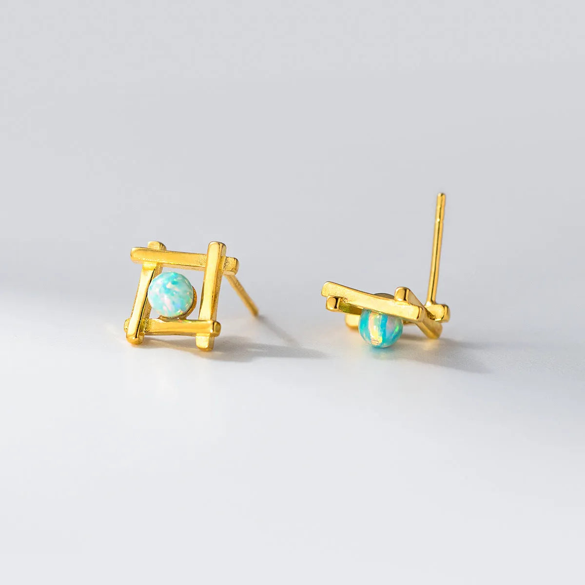 Geometric cross quadrangle stud earrings in 925 silver with silver or gold finish