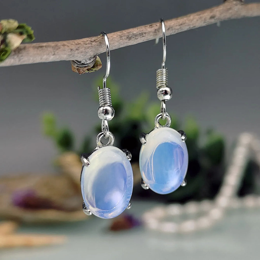 Moonlight white opal earrings with retro moonstone cross design and drop shape