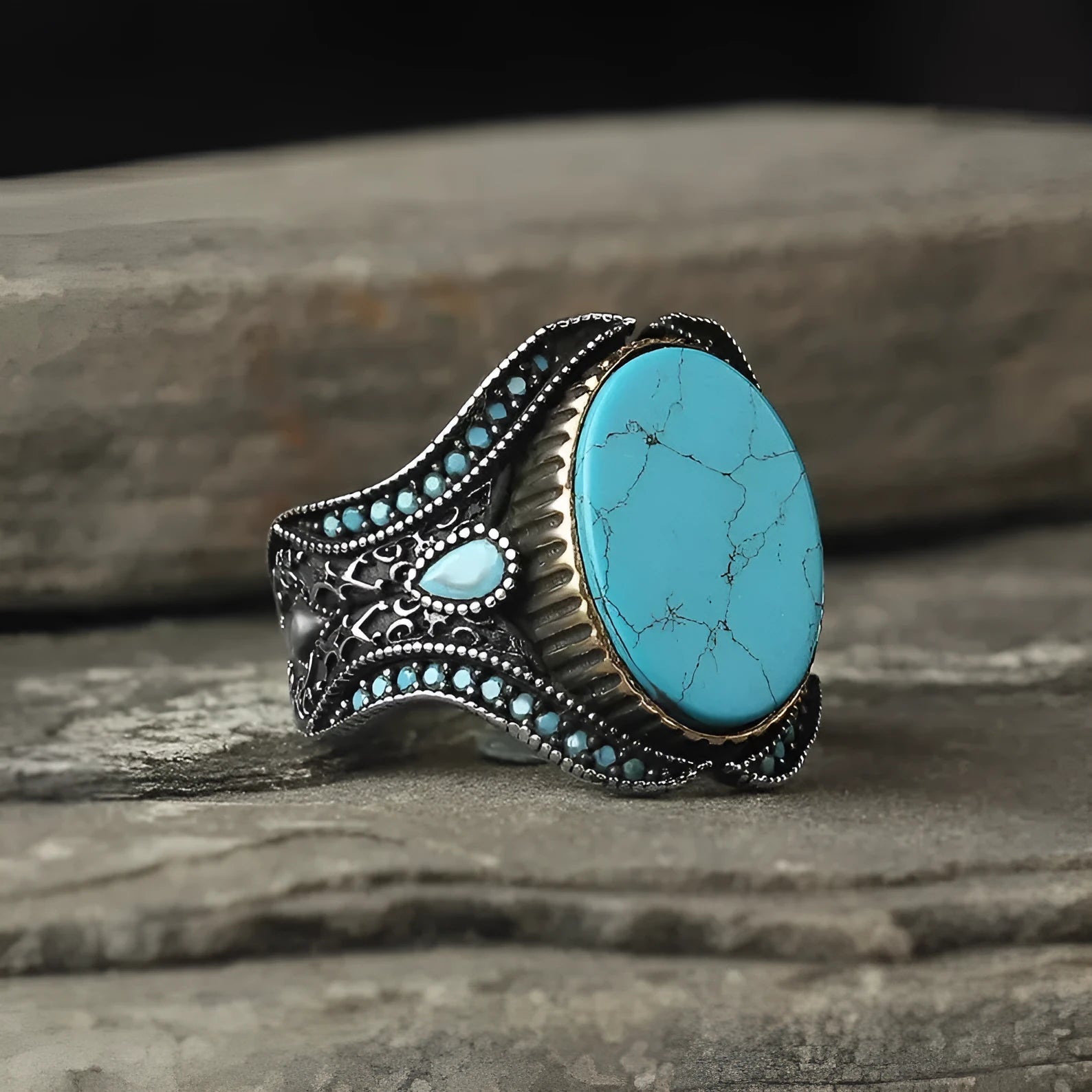 Men's turquoise and antique silver alloy ring on finger showing round band design with UK size markings