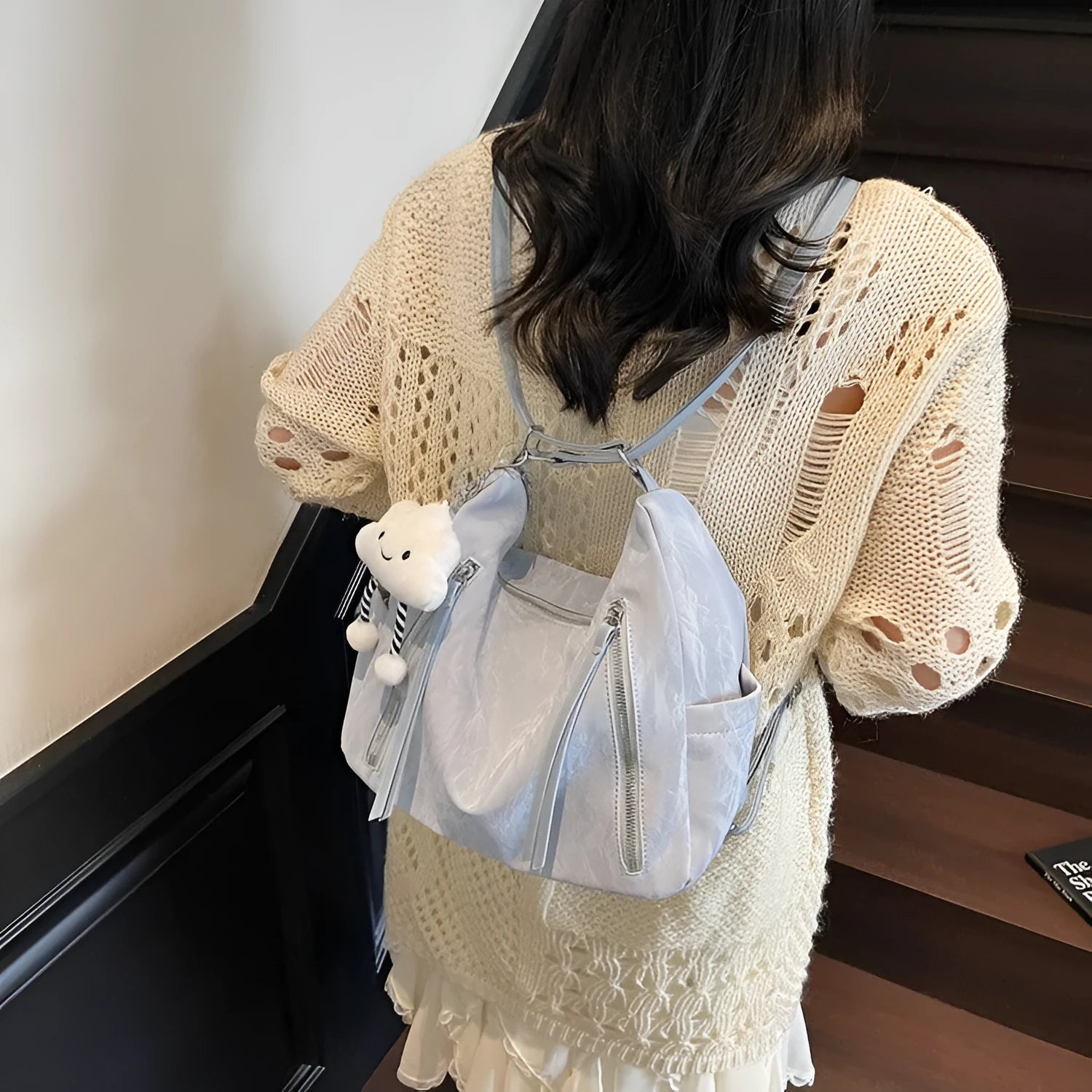 Women's soft PU backpack in blue with a matching detachable pendant for convertible carry