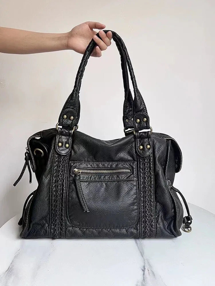 French retro women's motorcycle messenger bag in brown with weaving pattern detail and single shoulder strap