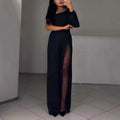 Black women's jumpsuit with an oblique shoulder neckline, long sleeves, a high leg slit, and a mid waist.