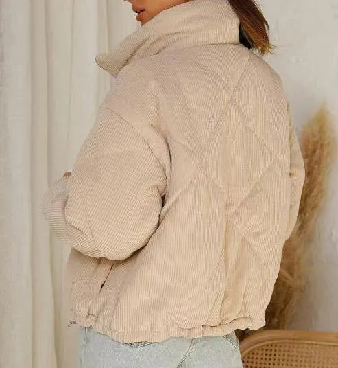 Women's apricot corduroy wadded jacket with stand collar and full-length front zipper showing street fashion styling