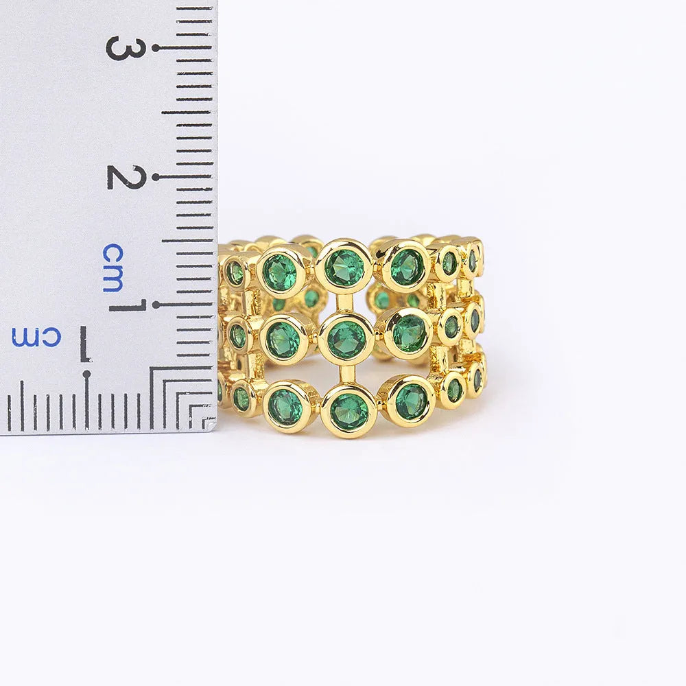 Copper ring with 18K gold plating and green zircon stones in wide band unisex design