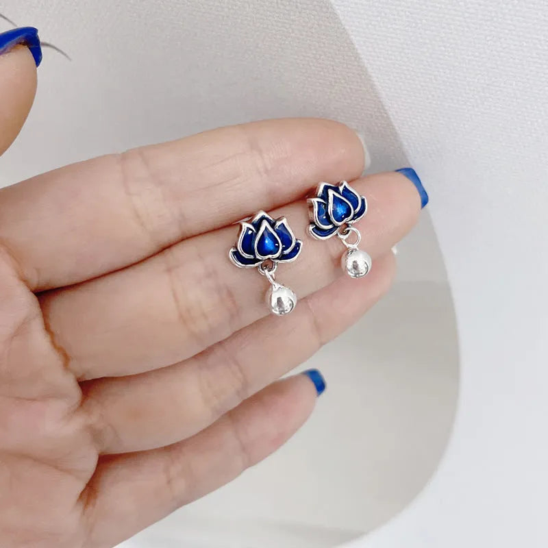 Women's lotus seedpod earrings with tassel accents in silver needle alloy