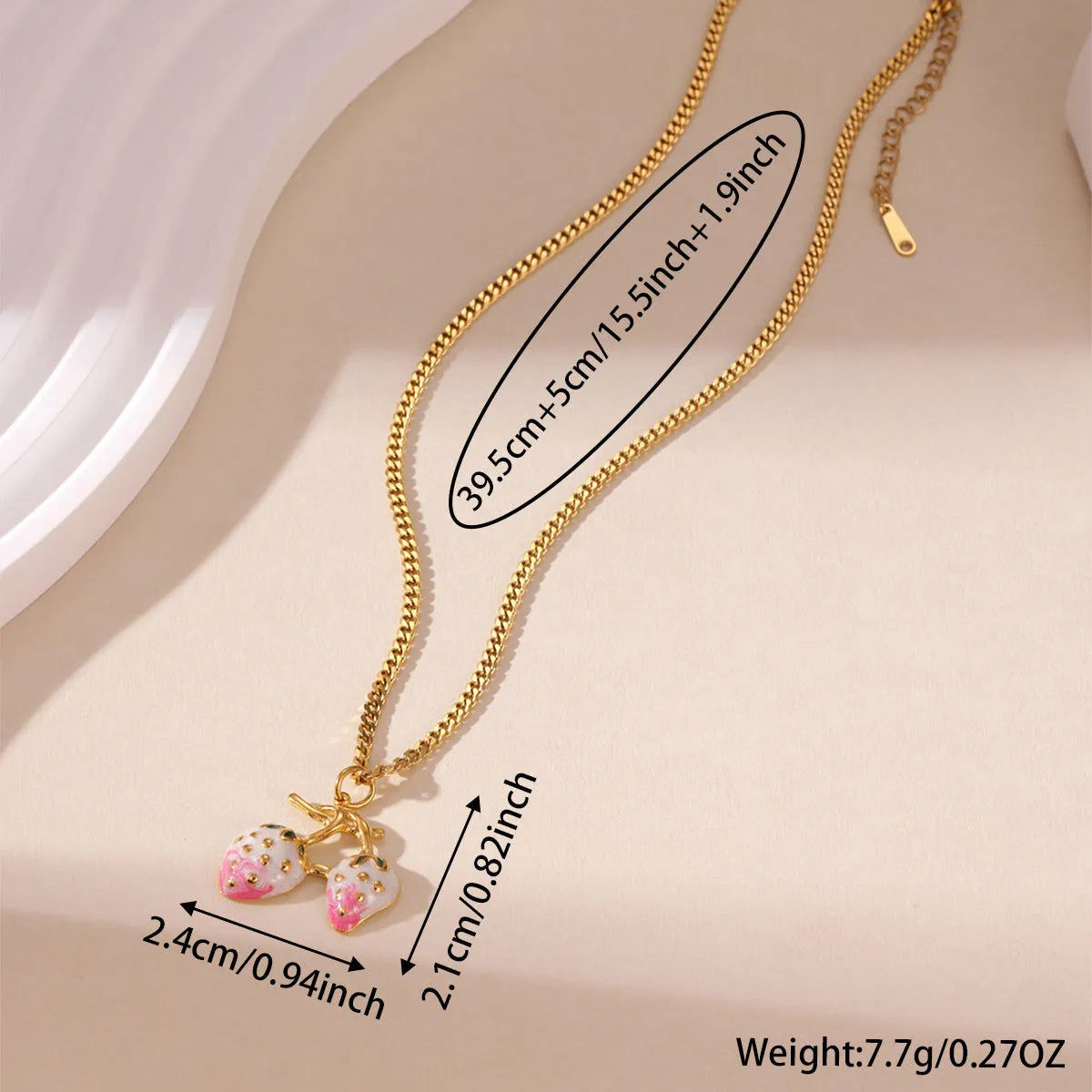 Close-up of a women's stainless steel strawberry pendant necklace on an alloy chain, showing red and white gradient colour options.