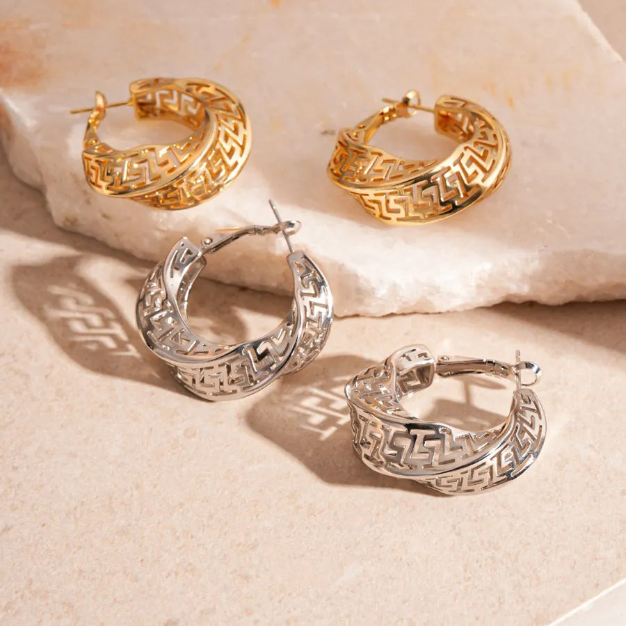 Women's geometric hollow stud earrings with twisted round design in silver or gold finish