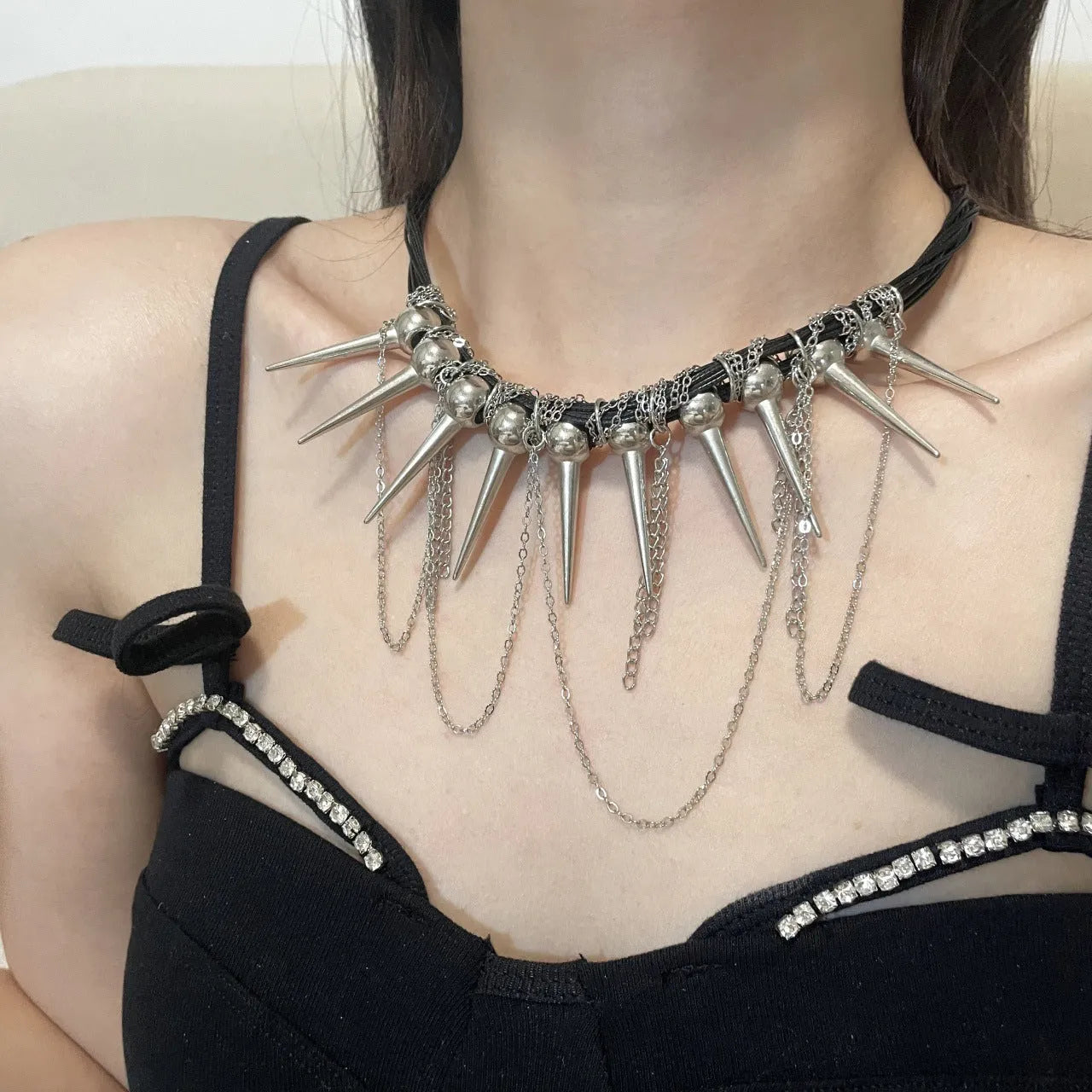 Leather necklace with round beads, winding tassel, and point rivet details in casual style