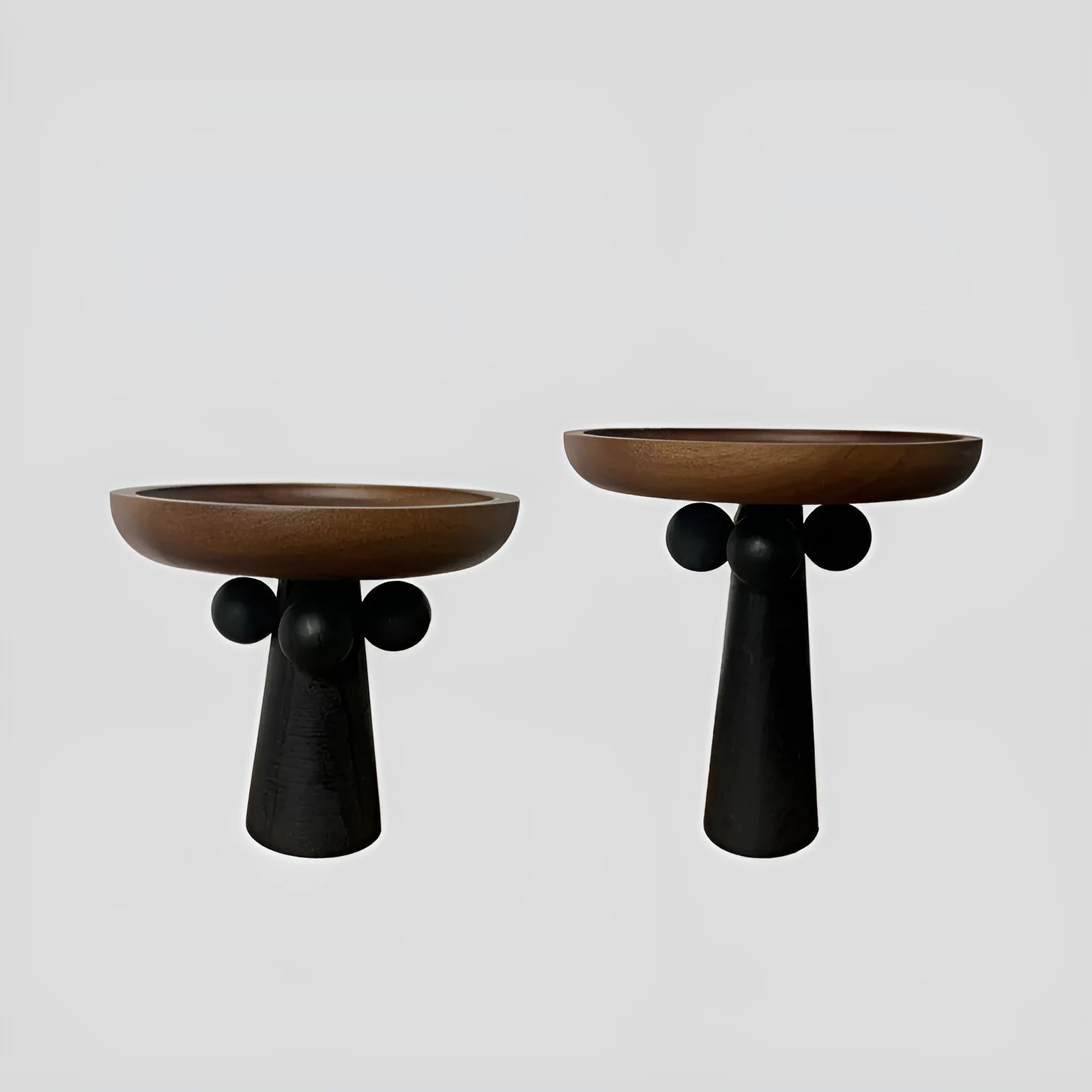 Nordic style wooden tray with four raised legs holding candles and aromatherapy bottles