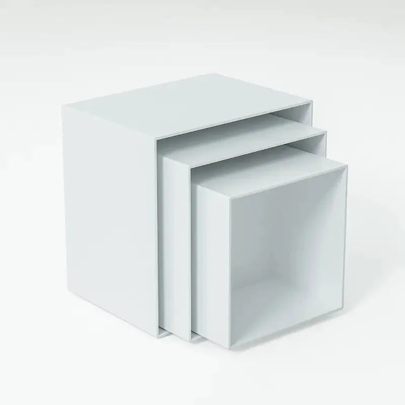 White plastic modular dessert display stand with six interlocking cube pieces arranged in a tiered configuration.