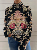 Black turtleneck sweater with a 3D pattern, loose fit, and regular sleeves on a hanger.