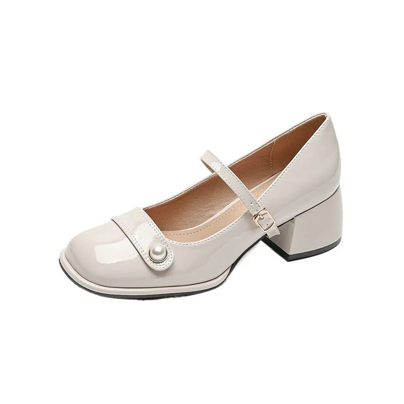 Plus size patent leather pumps with chunky block heels in apricot colour, showing square toe design and buckle fastening