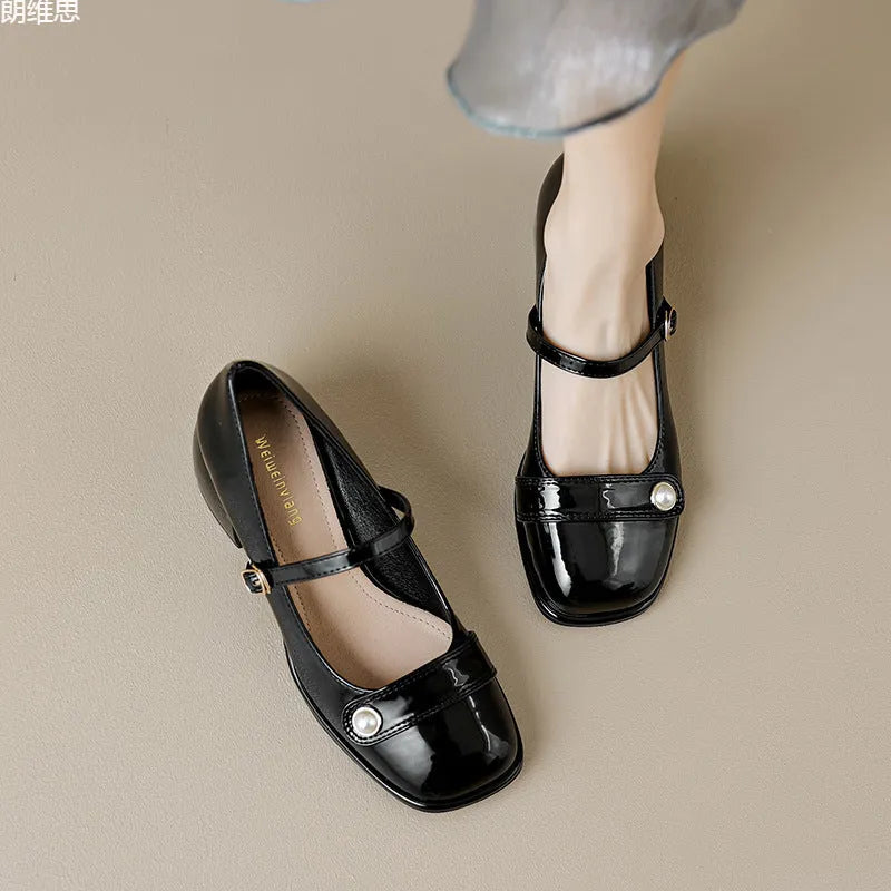 Plus size patent leather pumps with chunky block heels in apricot colour, showing square toe design and buckle fastening