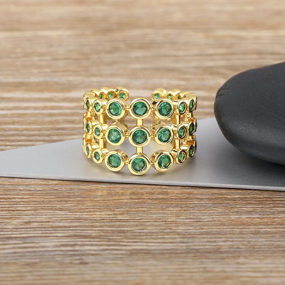 Copper ring with 18K gold plating and green zircon stones in wide band unisex design