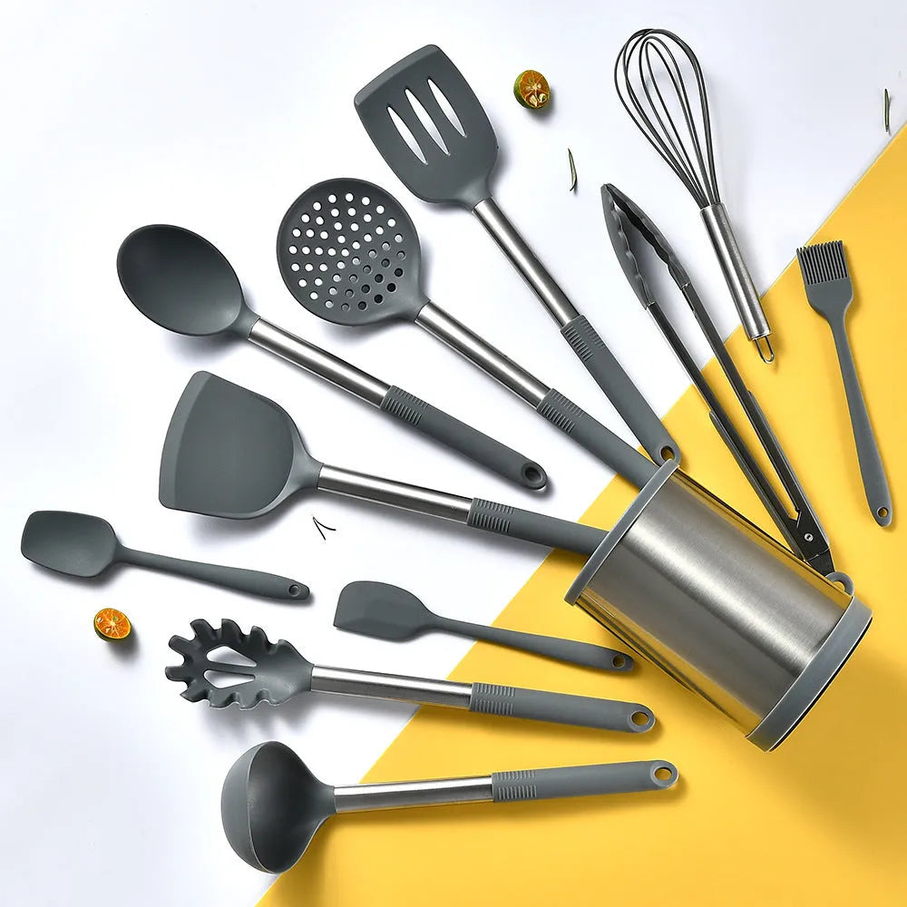 12 piece silicone kitchenware set with rotating storage bucket containing ladle spatula and clips