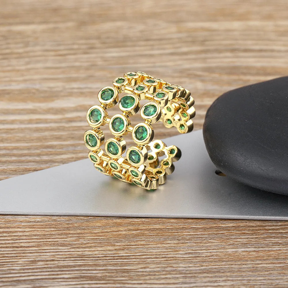 Copper ring with 18K gold plating and green zircon stones in wide band unisex design