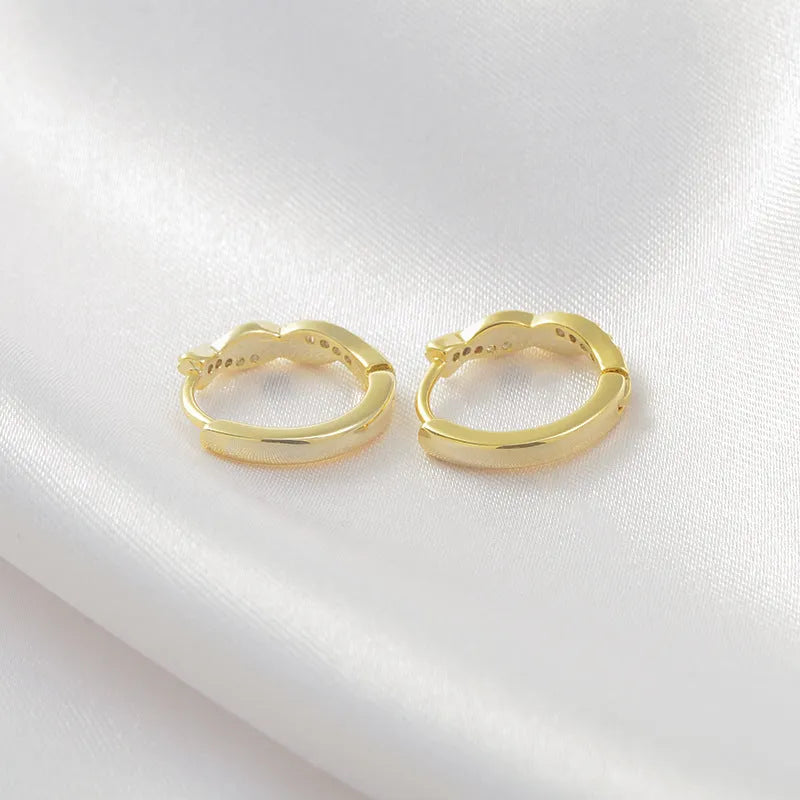 Geometric hemp rope earclip earrings with interwoven design in gold or silver colour options