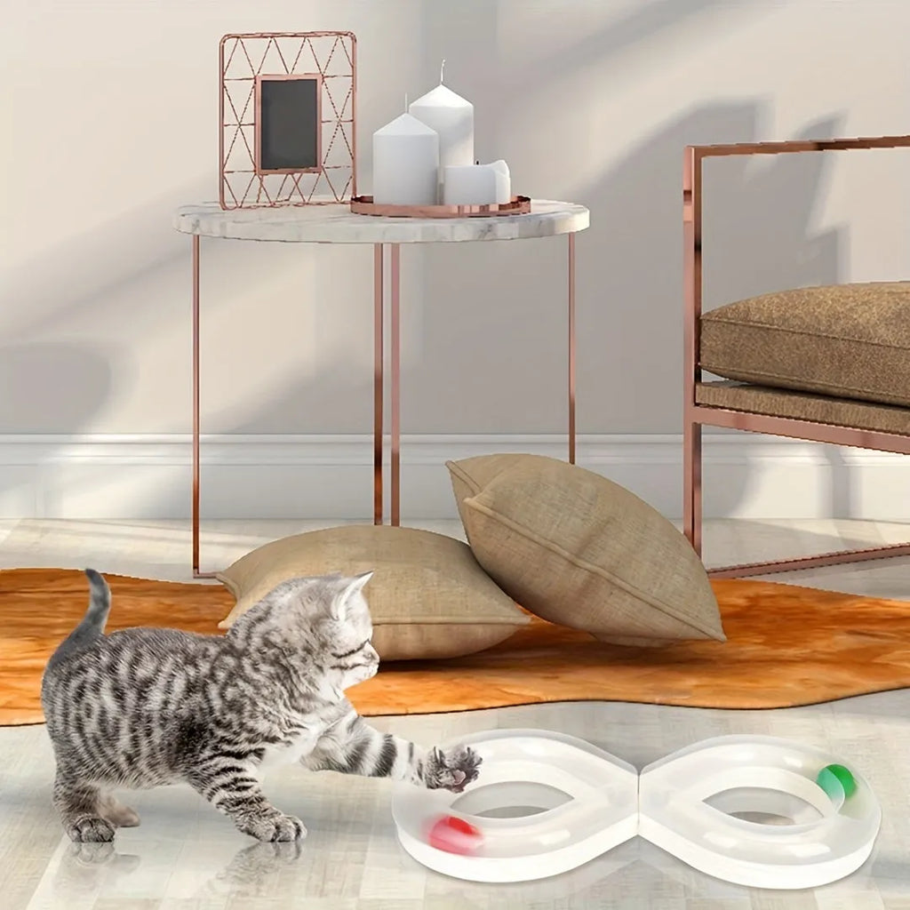 Blue cat turntable toy with rotating ball track and feather teaser wand on floor