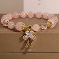 Unisex crystal bead bracelet in aquamarine butterfly colour on neutral background